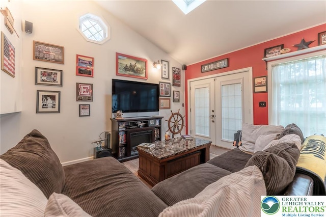 3195 Audubon St, Palmer Twp, PA 18045 - living room with french doors, lofted ceiling, and a skylight