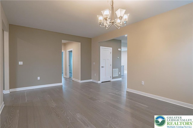 3610 Sweet Meadow Ct, Macungie Boro, PA 18062 - spare room with dark wood-type flooring and a chandelier