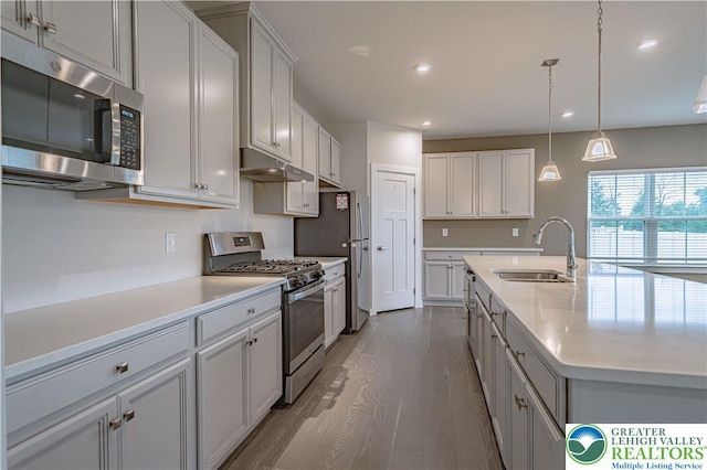 3610 Sweet Meadow Ct, Macungie Boro, PA 18062 - kitchen featuring appliances with stainless steel finishes, under cabinet range hood, wood finished floors, light countertops, and recessed lighting