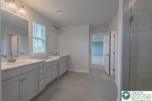 3610 Sweet Meadow Ct, Macungie Boro, PA 18062 - bathroom with double vanity, a tile shower, and tile patterned floors
