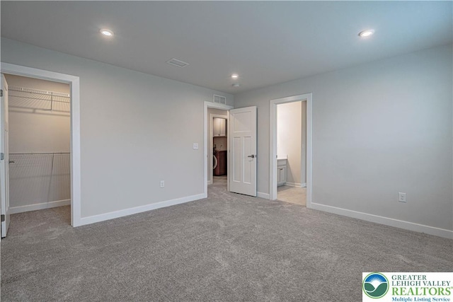 3610 Sweet Meadow Ct, Macungie Boro, PA 18062 - unfurnished bedroom featuring a spacious closet, carpet flooring, recessed lighting, ensuite bathroom, and a closet