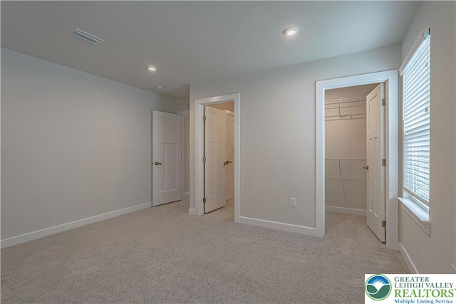 3610 Sweet Meadow Ct, Macungie Boro, PA 18062 - unfurnished bedroom featuring a spacious closet, multiple windows, light colored carpet, a closet, and recessed lighting