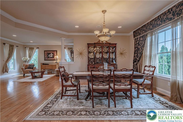 6532 Forest Knoll Ct, Upper Macungie Twp, PA 18106 - dining space with a chandelier, healthy amount of natural light, light wood-style flooring, ornamental molding, and recessed lighting