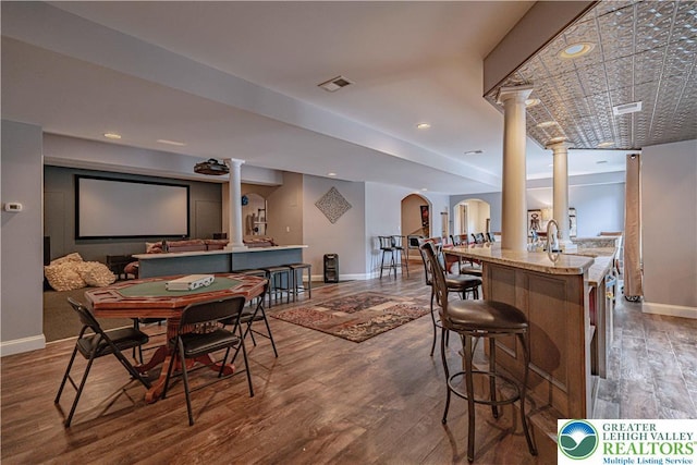 6532 Forest Knoll Ct, Upper Macungie Twp, PA 18106 - dining space featuring ornate columns and wood finished floors