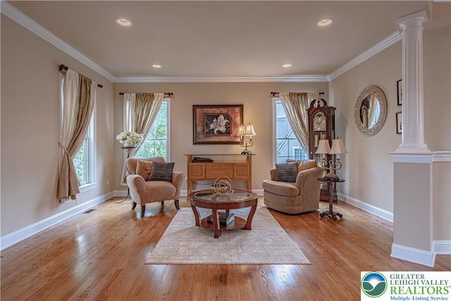 6532 Forest Knoll Ct, Upper Macungie Twp, PA 18106 - living room featuring healthy amount of natural light, light wood-style flooring, crown molding, decorative columns, and recessed lighting