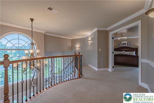 6532 Forest Knoll Ct, Upper Macungie Twp, PA 18106 - hall featuring a chandelier, carpet floors, ornamental molding, and an upstairs landing