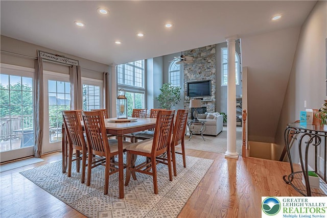 6532 Forest Knoll Ct, Upper Macungie Twp, PA 18106 - dining area featuring recessed lighting, light wood-style flooring, a stone fireplace, decorative columns, and a ceiling fan