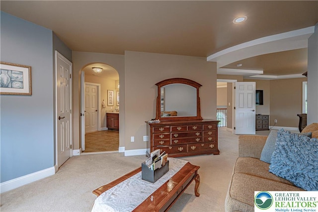 6532 Forest Knoll Ct, Upper Macungie Twp, PA 18106 - living room featuring arched walkways, light colored carpet, and recessed lighting