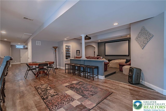 6532 Forest Knoll Ct, Upper Macungie Twp, PA 18106 - cinema room featuring wood finished floors, decorative columns, and recessed lighting