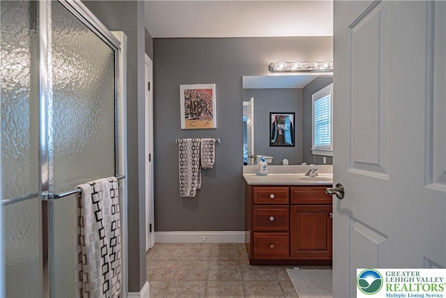 6532 Forest Knoll Ct, Upper Macungie Twp, PA 18106 - full bathroom featuring vanity, tile patterned floors, and a shower stall