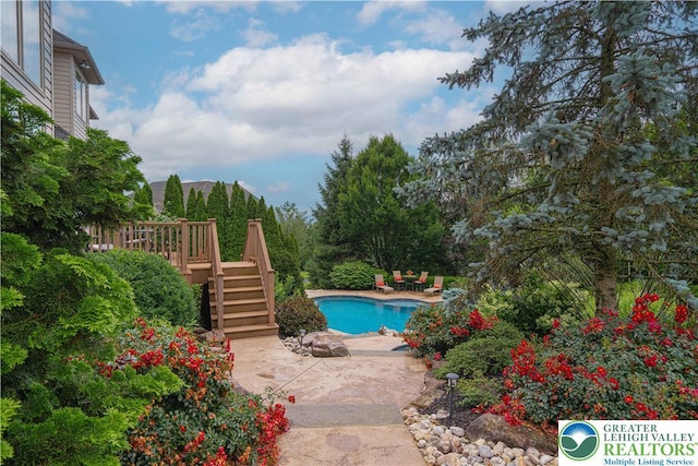 6532 Forest Knoll Ct, Upper Macungie Twp, PA 18106 - swimming pool featuring stairs and a wooden deck