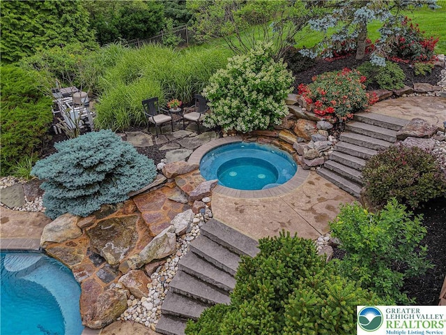 6532 Forest Knoll Ct, Upper Macungie Twp, PA 18106 - view of pool with an in-ground hot tub and a patio