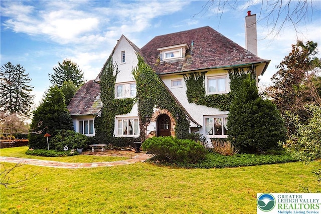 2730 Chew St, Allentown City, PA 18104 - tudor house with a chimney, a front lawn, and a high end roof