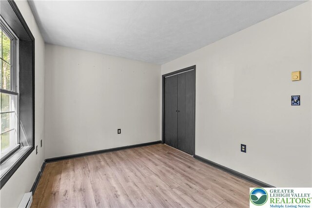 197 Broad Mountain View Dr, Penn Forest Twp, PA 18229 - spare room with light wood-style flooring and a baseboard radiator