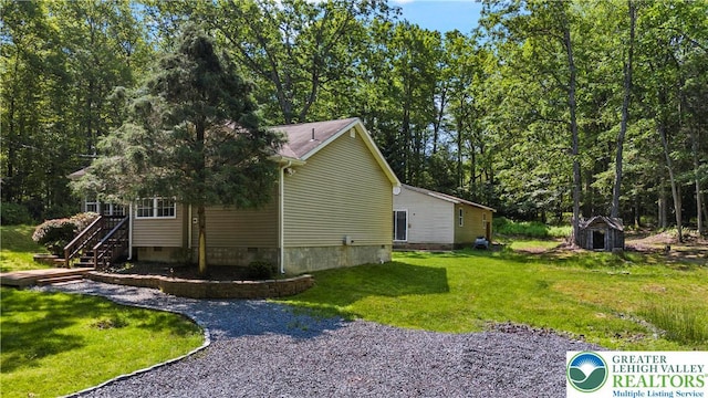 197 Broad Mountain View Dr, Penn Forest Twp, PA 18229 - view of property exterior featuring crawl space, a yard, and stairway