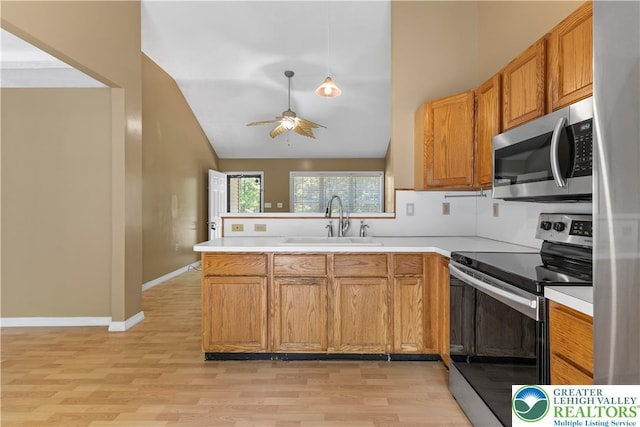 197 Broad Mountain View Dr, Penn Forest Twp, PA 18229 - kitchen featuring appliances with stainless steel finishes, a ceiling fan, light wood-style floors, light countertops, and high vaulted ceiling