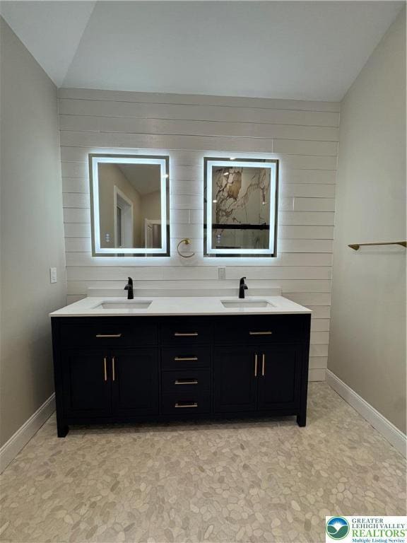 211 Maxatawny Dr, Coolbaugh Twp, PA 18347 - full bath with double vanity, lofted ceiling, and wood walls