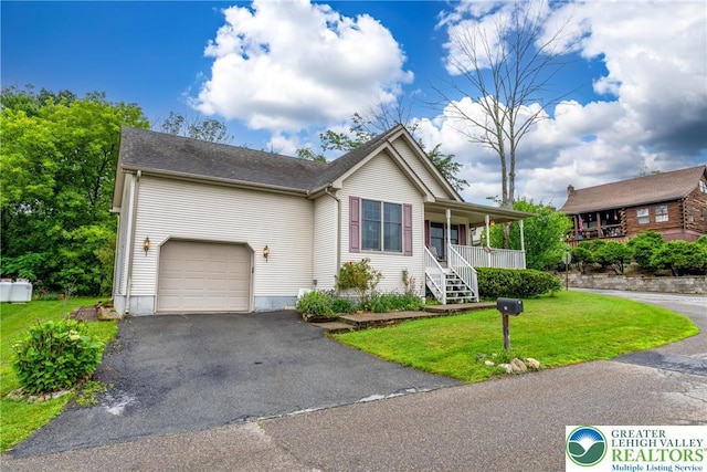 11 Apache Dr, Upper Mt Bethel Twp, PA 18343 - view of front of property featuring covered porch, a front lawn, an attached garage, and driveway