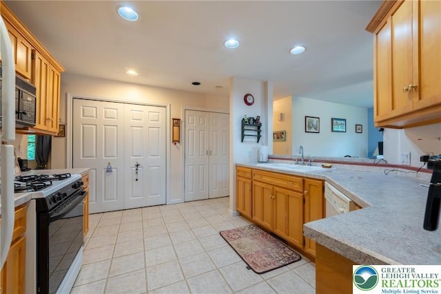 11 Apache Dr, Upper Mt Bethel Twp, PA 18343 - kitchen featuring gas range, light tile patterned flooring, light countertops, recessed lighting, and black microwave