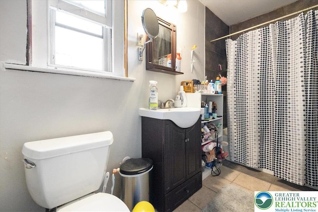 519 N 8th St, Allentown City, PA 18102 - bathroom with vanity, tile patterned floors, and a shower with shower curtain