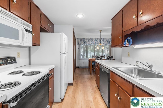 1411 Linden St, Bethlehem City, PA 18018 - kitchen featuring electric range oven, white microwave, dishwasher, light countertops, and light wood-type flooring