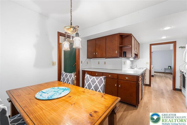 1411 Linden St, Bethlehem City, PA 18018 - kitchen featuring open shelves, light wood finished floors, light countertops, recessed lighting, and decorative light fixtures