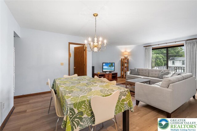 1411 Linden St, Bethlehem City, PA 18018 - dining area with a chandelier and wood finished floors