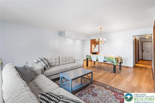 1411 Linden St, Bethlehem City, PA 18018 - living area with a chandelier and light wood-style floors
