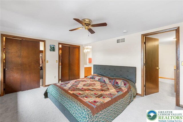 1411 Linden St, Bethlehem City, PA 18018 - carpeted bedroom with multiple closets and a ceiling fan