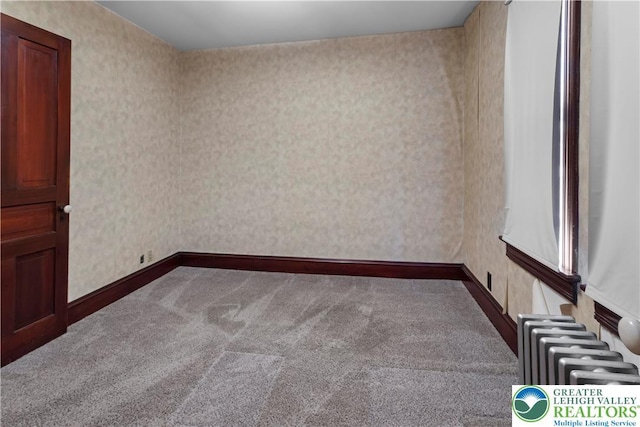 170 S Whitfield St, Nazareth Boro, PA 18064 - spare room featuring radiator, carpet floors, and wallpapered walls
