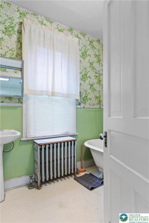 170 S Whitfield St, Nazareth Boro, PA 18064 - bathroom with wallpapered walls, radiator heating unit, and a freestanding tub