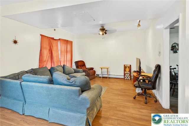 485 S Walnut St, Slatington Boro, PA 18080 - living room with wood finished floors, baseboard heating, and a ceiling fan