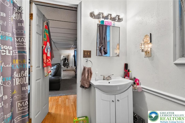 485 S Walnut St, Slatington Boro, PA 18080 - full bathroom featuring vanity, wood finished floors, and a textured wall