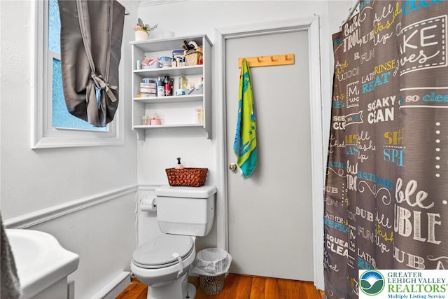 485 S Walnut St, Slatington Boro, PA 18080 - bathroom with wood finished floors and a shower with shower curtain