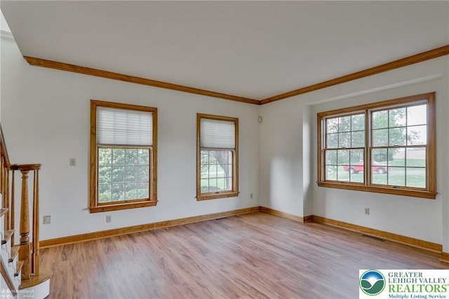 634 Country Club Rd, Easton, PA 18045 - empty room with stairway, light wood finished floors, and ornamental molding