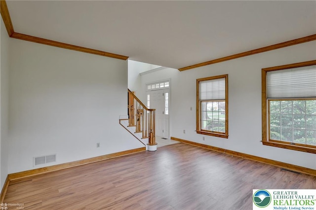 634 Country Club Rd, Easton, PA 18045 - unfurnished living room with wood finished floors, plenty of natural light, crown molding, and stairs