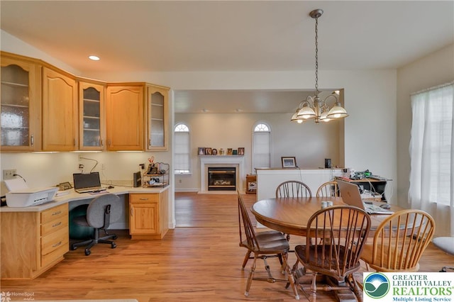 634 Country Club Rd, Easton, PA 18045 - dining room featuring plenty of natural light, light wood-style floors, a glass covered fireplace, built in study area, and recessed lighting