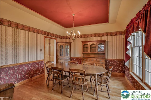 634 Country Club Rd, Easton, PA 18045 - dining space with wallpapered walls, light wood-type flooring, a chandelier, and a raised ceiling