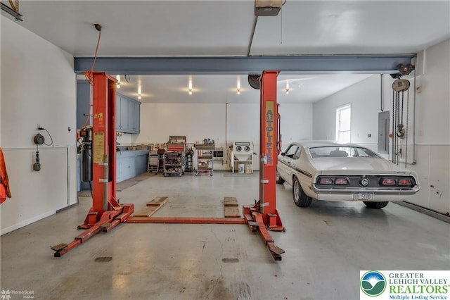 634 Country Club Rd, Easton, PA 18045 - garage featuring electric panel and a garage door opener