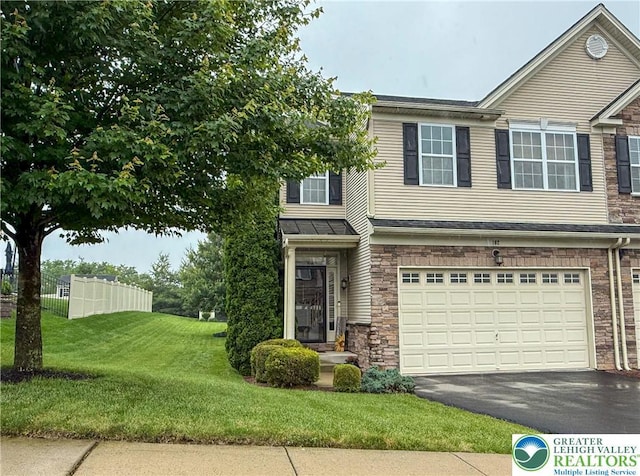 102 Gray Dr, Allen Twp, PA 18067 - view of front facade featuring a garage, asphalt driveway, and stone siding