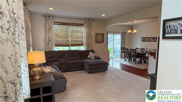 102 Gray Dr, Allen Twp, PA 18067 - carpeted living room featuring a chandelier and recessed lighting