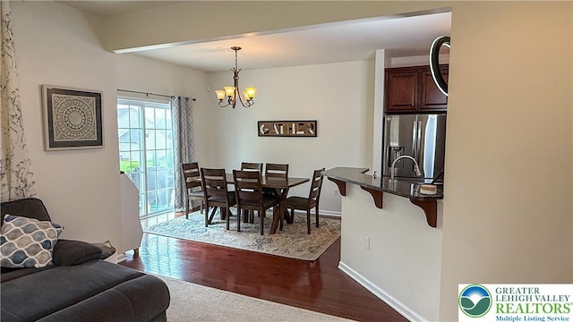 102 Gray Dr, Allen Twp, PA 18067 - dining area featuring a chandelier and dark wood-type flooring
