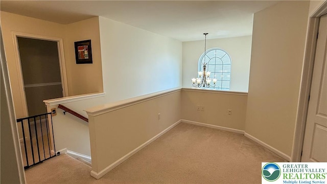102 Gray Dr, Allen Twp, PA 18067 - corridor with a chandelier, light carpet, and an upstairs landing