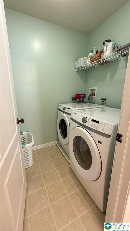 102 Gray Dr, Allen Twp, PA 18067 - laundry area featuring separate washer and dryer and light tile patterned flooring