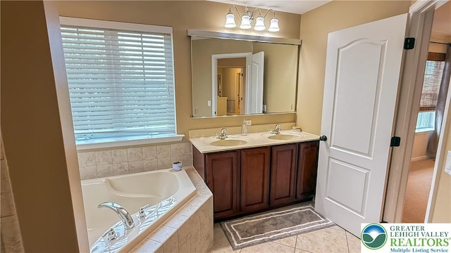 102 Gray Dr, Allen Twp, PA 18067 - bathroom featuring a bath, double vanity, and tile patterned floors