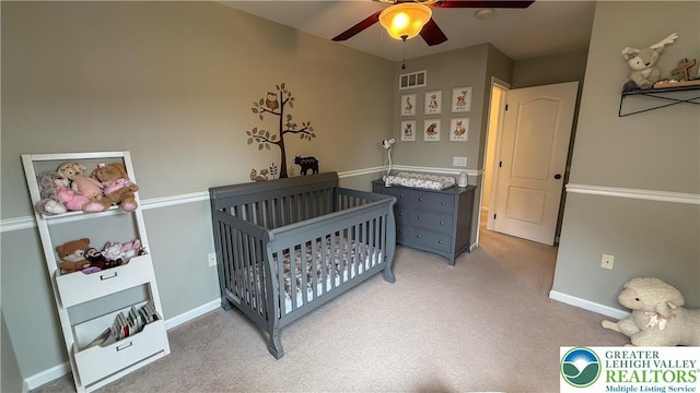 102 Gray Dr, Allen Twp, PA 18067 - bedroom featuring a crib, light carpet, and ceiling fan