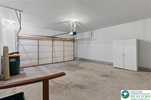 1883 Gregory Pl, Lower Saucon Twp, PA 18055 - garage featuring a garage door opener and baseboards
