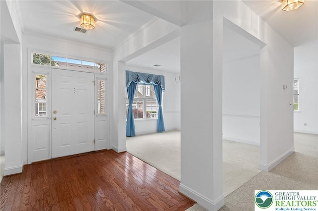 1883 Gregory Pl, Lower Saucon Twp, PA 18055 - foyer entrance with ornamental molding, wood finished floors, and carpet flooring