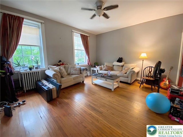 209 Northampton St, Easton, PA 18042 - living area featuring radiator, hardwood / wood-style flooring, and a ceiling fan