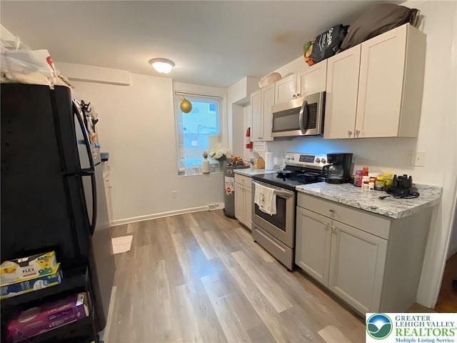 209 Northampton St, Easton, PA 18042 - kitchen with appliances with stainless steel finishes and light wood finished floors